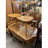 PINE EFFECT DROP FLAP KITCHEN TABLE AND FOUR SPINDLE BACK BEECH CHAIRS