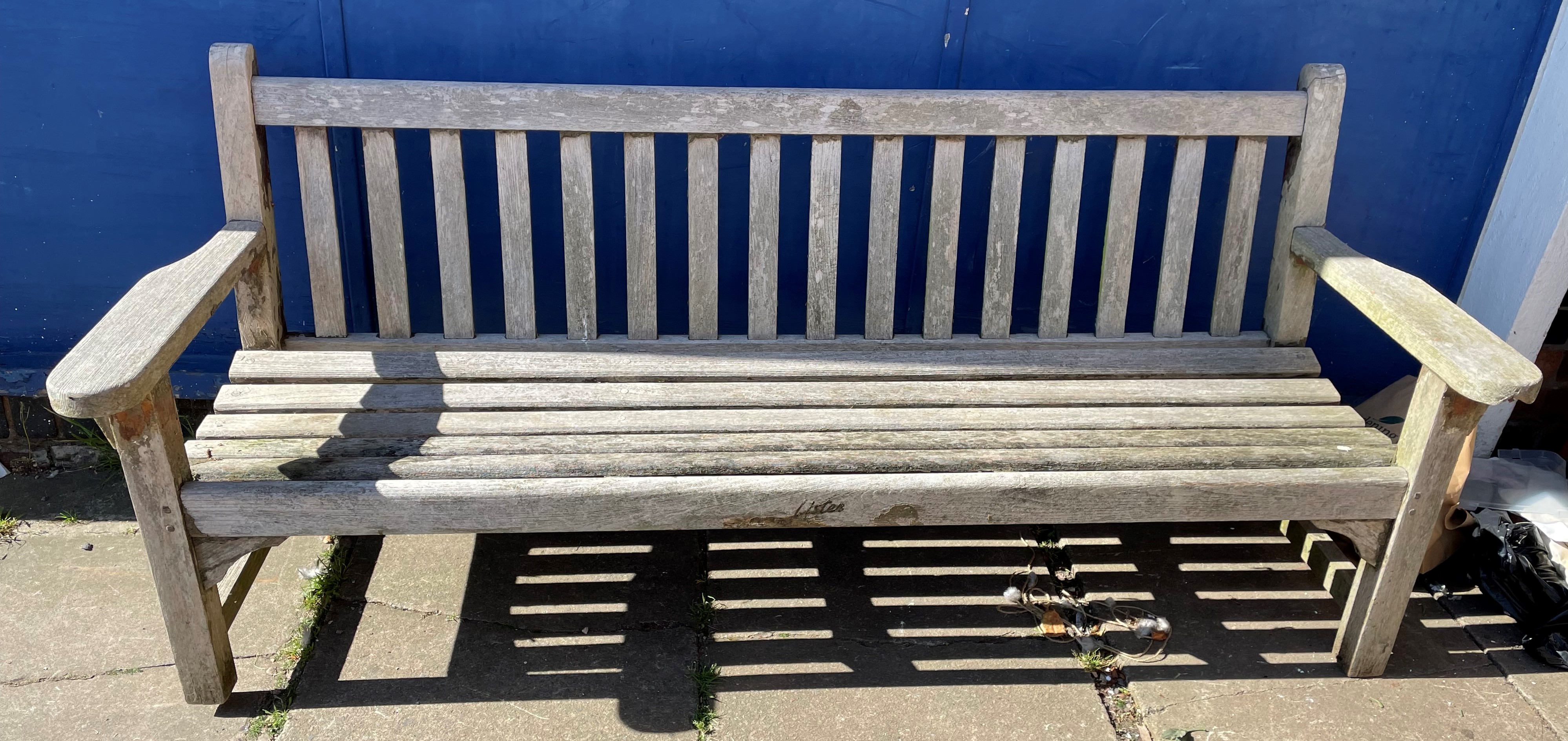 WEATHERED HARD WOOD SLATTED BENCH