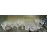 SHELF OF CUT GLASSWARE INCLUDING ETCHED TUMBLERS, BALLOONS AND WINE GLASSES,