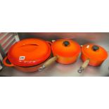 ORANGE LE CRESUET SHALLOW DISH AND COVER AND TWO SAUCE PANS