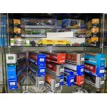 TWO SHELVES OF VARIOUS CORGI SUPER HAULER DIE CAST CARTS AND OTHER MODELS