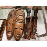 PAIR OF CARVED SNAKE FACE MASKS AND PAIR OF WALL CANDLE HOLDERS