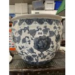 CHINESE INSPIRED BLUE AND WHITE OVOID PLANTER