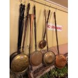 BRASS AND COPPER WARMING PAN WITH WRIGGLEWORK DECORATION AND SIX OTHER WARMING PANS