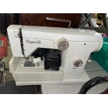 CASED ELECTRIC SEWING MACHINE