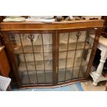 WALNUT SERPENTINE FRONTED GLAZED TWO DOOR CABINET (NO FEET) 104CM H X 119CM W X 35CM D APPROX.