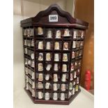 WALL MOUNTED CANTED CABINET OF CERAMIC THIMBLES INCLUDING CORONATION STREET CHARACTERS