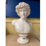 PLASTER BUST OF A MALE WEARING A GARLAND OF FLOWERS 41CM H APPROX