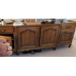 19TH CENTURY FRENCH PROVINCIAL SERPENTINE LONG SIDEBOARD WITH ARCHED FIELDED MOULDED PANEL DOORS ON