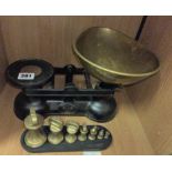 SALTER PAN SCALES AND A RACK OF BRASS BELL WEIGHTS