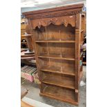 RECLAIMED PINE BOOK CASE WITH MOULDED DENTIL CORNICE ABOVE A CARVED RIBBON AND BOW FRIEZE HEIGHT