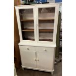 WHITE PAINTED GLAZED CABINET AND BASE WITH TWO FITTED DRAWERS OVER CUPBOARD DOORS HEIGHT 170CM,