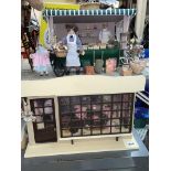 DOLLS HOUSE MILLINERY SHOP COMPLETE WITH FIGURES AND ACCESSORIES AND A DOLLS HOUSE MARKET FRUIT AND