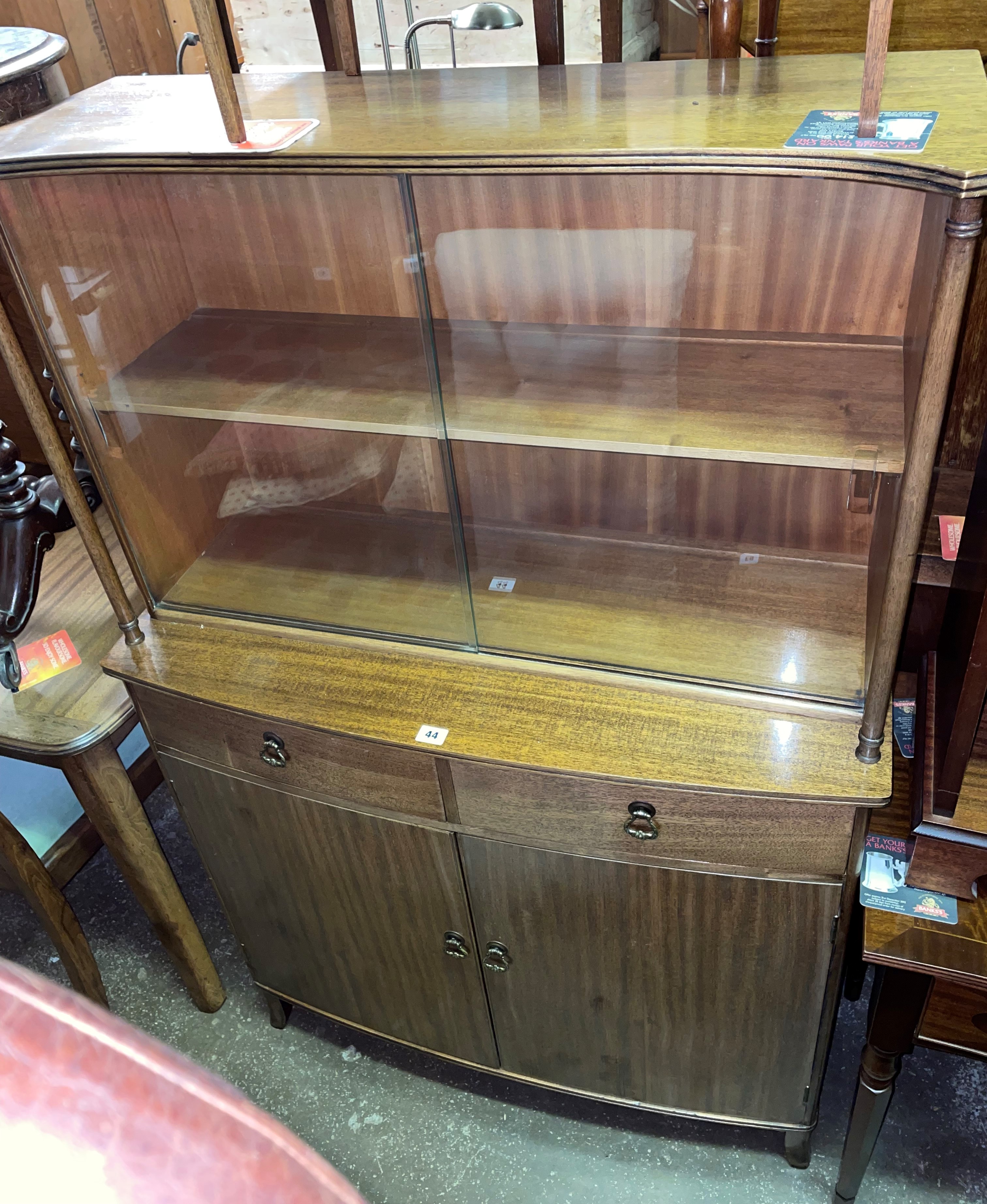 MAHOGANY GLAZED BOW FRONTED CABINET WITH GLASS SLIDING DOORS