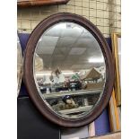 MAHOGANY OVAL BEVELED MIRROR 59CM X 48CM