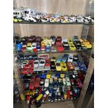 FIVE SHELVES OF DIE CAST MODEL FORMULA ONE AND RALLY CARS, VINTAGE CARS,