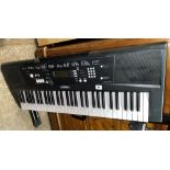 YAMMAHA EZ220 ELECTRONIC KEYBOARD ON FOLDING STAND