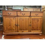 PINE SIDE CABINET FITTED WITH THREE DRAWERS ABOVE THREE CUPBOARDS