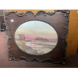 OVAL MOUNTED WATERCOLOUR OF A COASTAL SUNSET IN CARVED FRAME F/G
