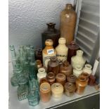 SELECTION OF STONEWARE ADVERTISING BOTTLES AND GREEN GLASS ADVERTISING BOTTLES