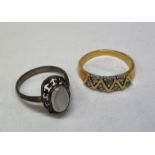 UNMARKED YELLOW METAL CHANNEL SET RING AND A SILVER MOON STONE RING