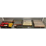 TWO SHELVES OF MODEL RAILWAY COACHES AND GOODS WAGONS