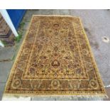 KESHAN WOLLEN CARPET DECORATED WITH FLORAL MOTIFS AND ANIMALS ON MUSTARD BROWN BACKGROUND WITH