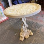 TRIFORM CARVED RESIN TABLE DEPICTING DRAGONS AND ELEPHANTS