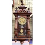 STAINED BEECH AND PINE PENDULUM WALL CLOCK WITH ARCHITECTURAL FINIALLED PEDIMENT