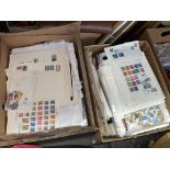TWO CARTONS OF LEAVES OF PAGES OF WORLD POSTAGE STAMPS