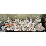 SHELF OF CRESTED CHINA WARES AND LATE VICTORIAN/ EDWARDIAN GERMAN SEASIDE SOUVENIR WARES
