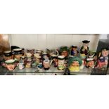 A SHELF OF MINIATURE JUG FIGURES INCLUDING ROYAL DOULTON AND OTHERS