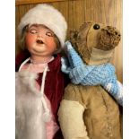 PORCELAIN HEADED DRESS DOLL AND A VINTAGE STRAW FILLED TEDDY BEAR A/F