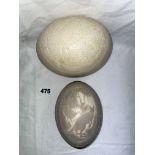 CARVED CAMEO OSTRICH EGG AND ONE OTHER