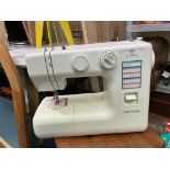 NEW HOME ELECTRIC SEWING MACHINE