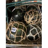 BASKET OF DECORATIVE GREEN GLASS FISHERMAN FLOATS