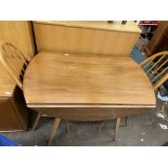 ERCOL LIGHT ELM DROP FLAP DINING TABLE AND FIVE SPINDLE BACK CHAIRS