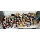 A LARGE SHELF OF CHARACTER AN TODY JUGS