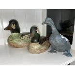 TWO WOODEN PAINTED DUCK MODELS AND A CAST METAL DUCK