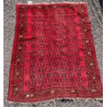 RED AND BLACK PATTERNED FRINGED RUG 189CM X 144CM