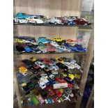 FIVE SHELVES OF UNBOXED DIE CAST MODEL CARS - POLICE CARS, AEROPLANES,