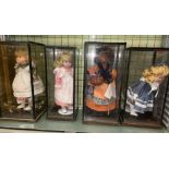 EIGHT PORCELAIN HEADED DRESS DOLLS IN CASES