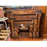 NEST OF THREE EASTERN HARDWOOD AND METAL STRAPWORK TABLES