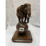 EASTERN CARVED WOOD ELEPHANT ON BALL FIGURE 23CM