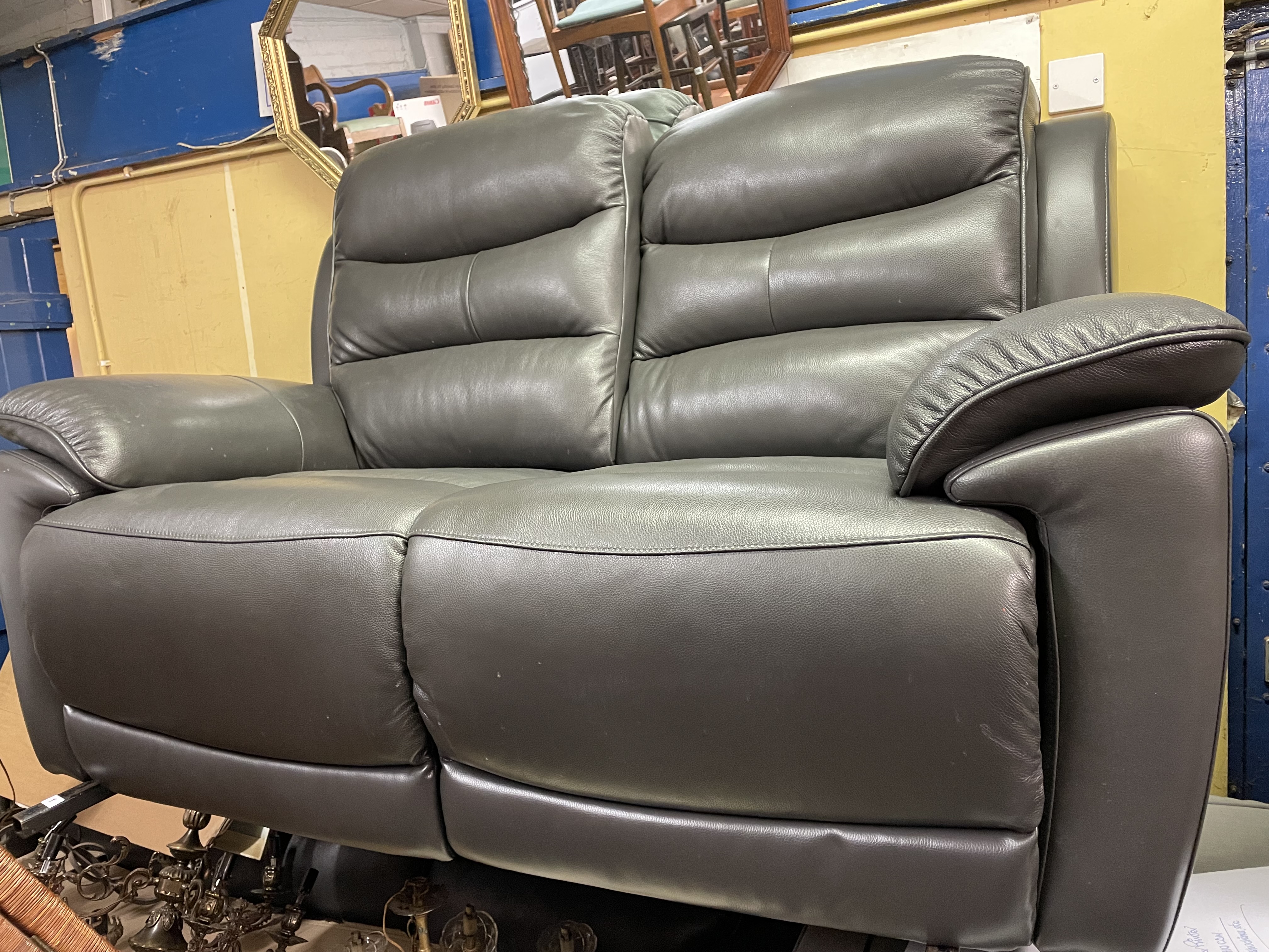 AS NEW SLATE GREY LEATHER RECLINING TWO SEATER SOFA