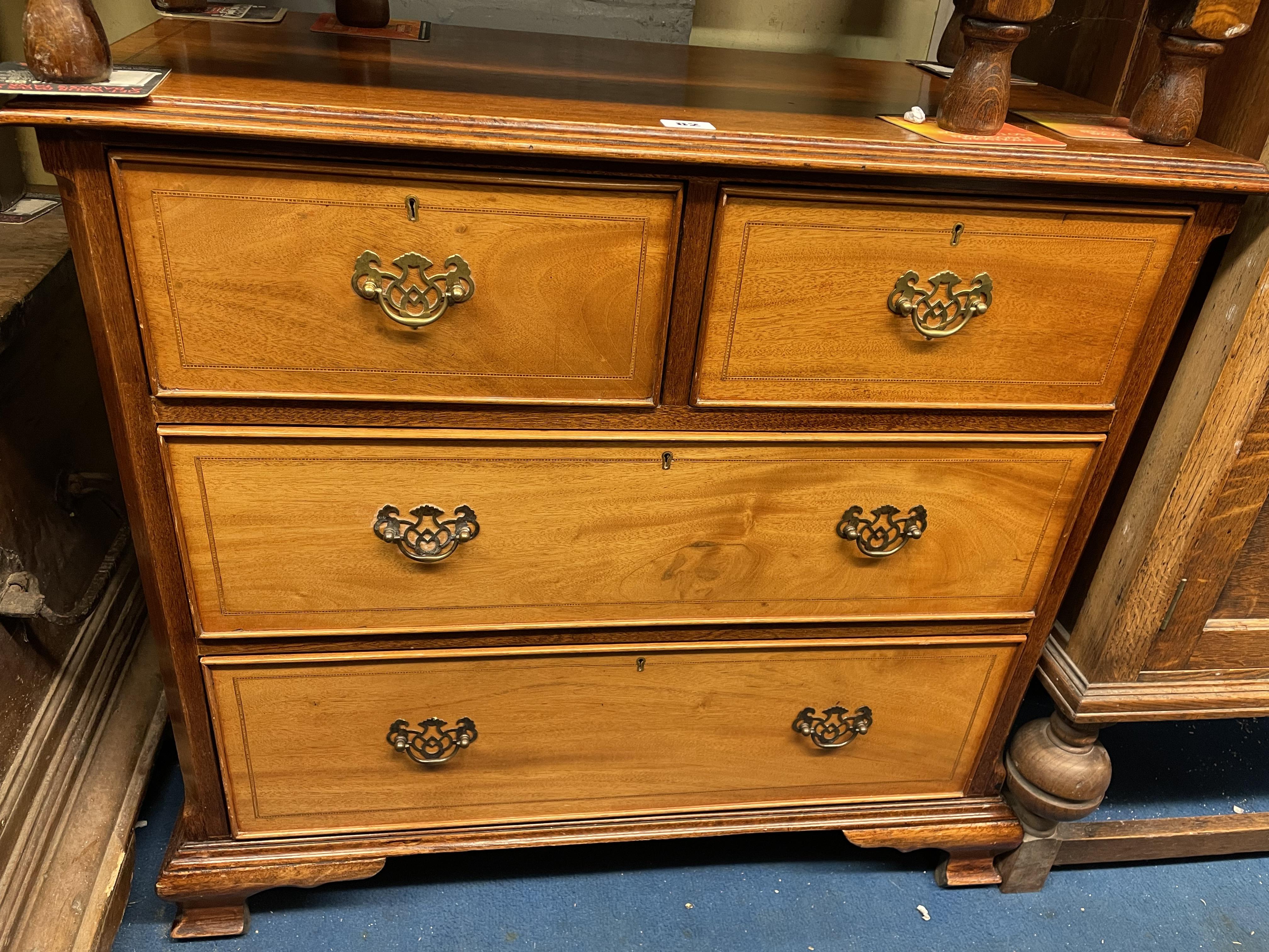 GOOD QUALITY MAHOGANY CHEQUER STRUNG TWO OVER TWO DOOR CHEST OF DRAWERS ON BRACKET FEET