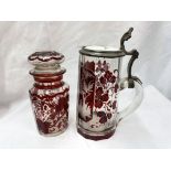 BOHEMIAN RUBY ETCHED STAG IN FOREST PANEL WITH GLASS CERAMIC LIDDED STEIN AND A BOHEMIAN RUBY
