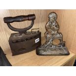 19TH CENTURY CHARCOAL SMOOTHING IRON AND A CAST METALWORK DOORSTOP WITH LOADED BASE