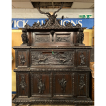 IMPRESSIVE 19TH CENTURY CARVED EBONISED HUNTING LODGE BUFFET CABINET-THE CRESTING CARVED WITH