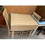 LIGHT OAK DROP FLAP DINING TABLE AND PAIR OF SLAT BACK CHAIRS